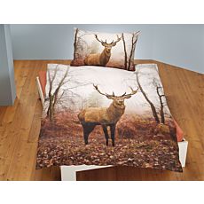 Parure de lit avec cerf dans une forêt