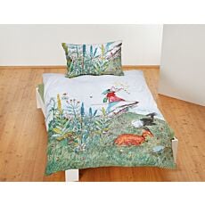 Parure de lit avec Flurina sur fond de prairie printanière