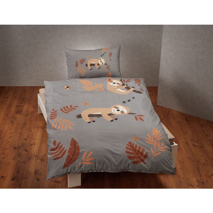 Parure de lit avec paresseux souriant sur une branche d'arbre main product photo