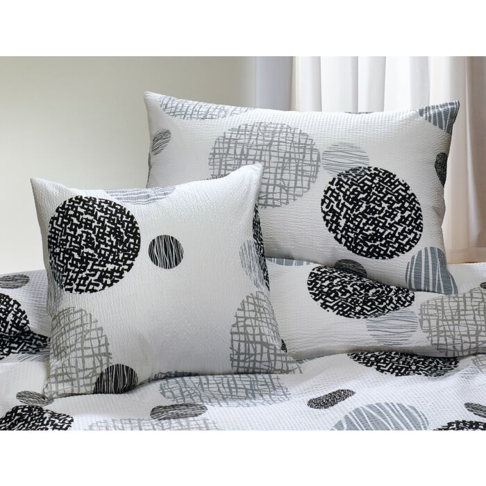 Linge de lit avec motif de cercles gris et noirs sur fond blanc